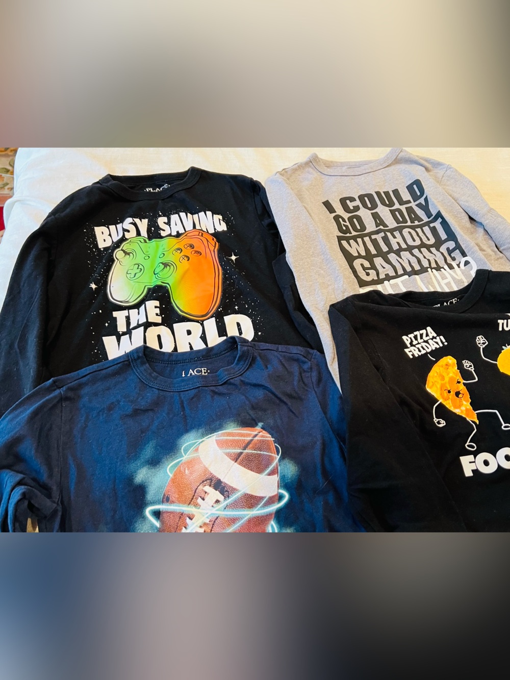 Set of 4 boys T shirts 
The Children's Place has Long-Sleeve Neon Gaming Graphic